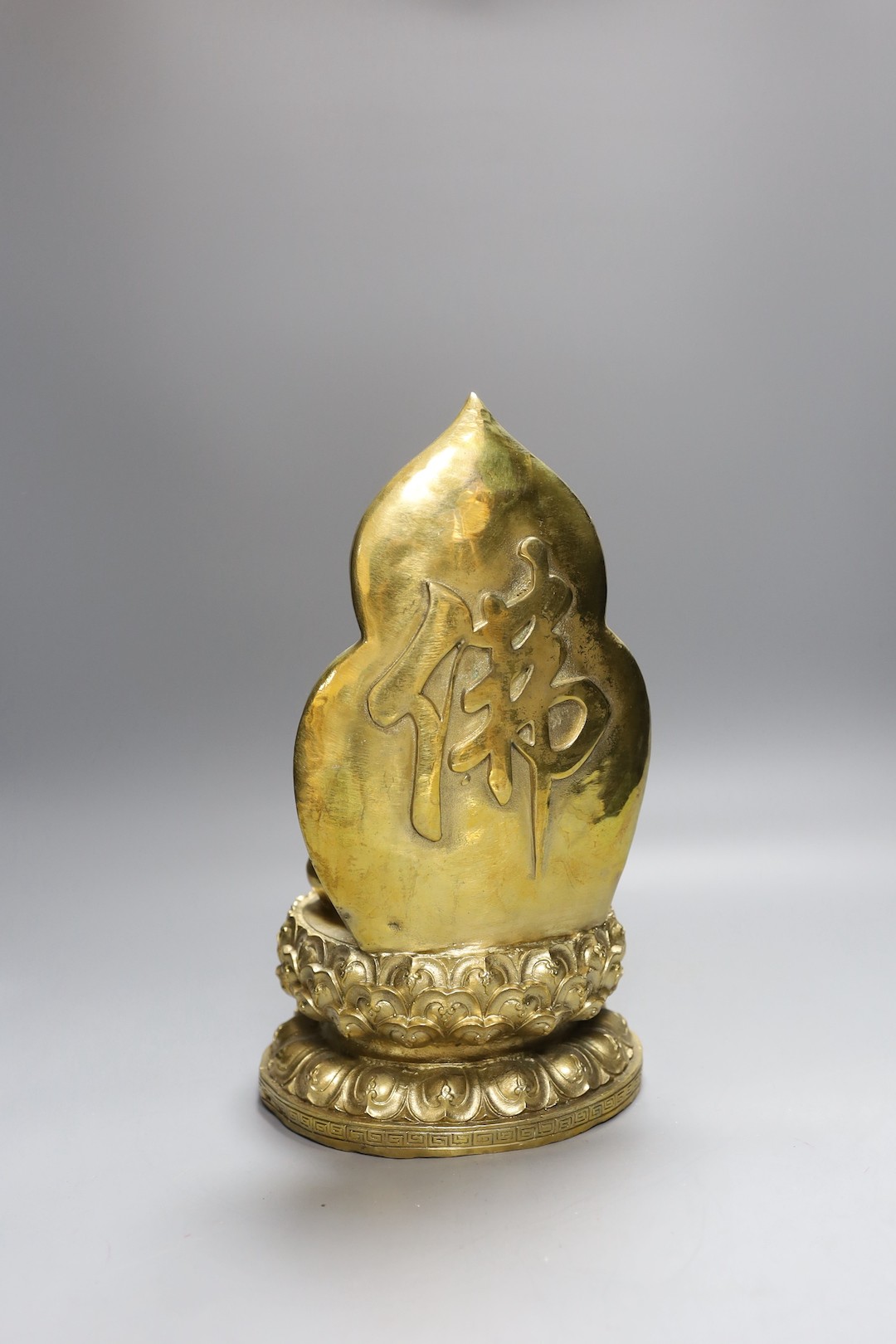 A Chinese built metal Buddha - 29cm high, a bronze Chinese lobed dish, together with a Tibetan teapot